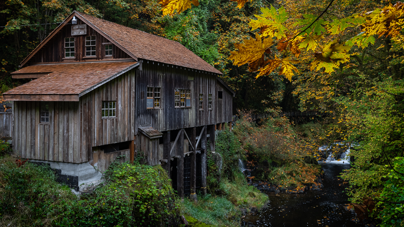 Cedar Creek Grist Mill surrounded by autumn foliage in Clark County, Washington
